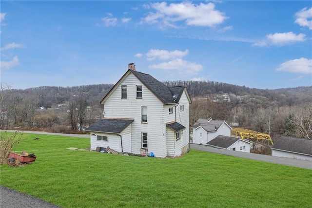 view of home's exterior with a yard