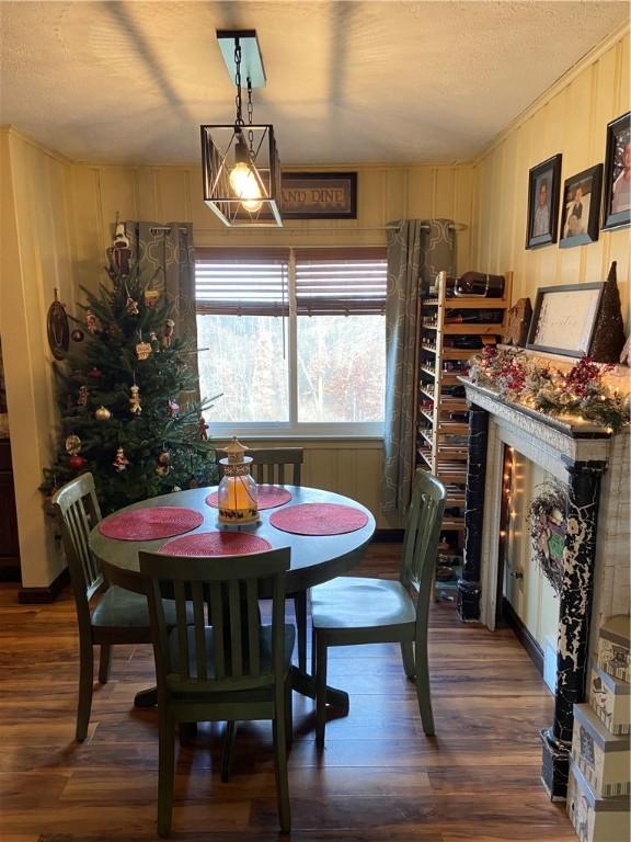 dining space with dark wood-type flooring