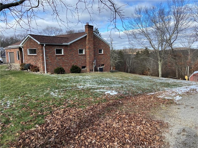 view of home's exterior with a yard and cooling unit