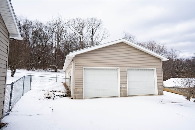 view of snow covered garage