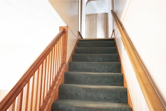 staircase featuring hardwood / wood-style floors