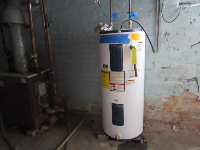 utility room with water heater