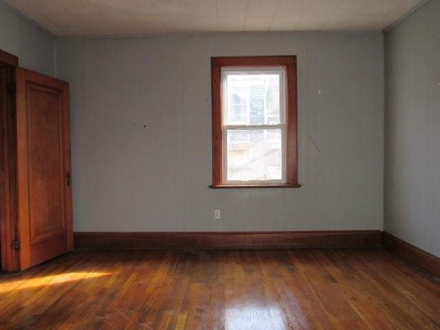 empty room featuring wood-type flooring