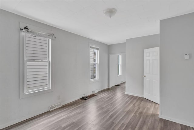 empty room with light wood-type flooring