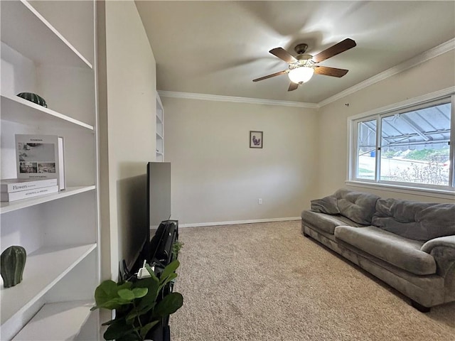 carpeted living room with ceiling fan and ornamental molding