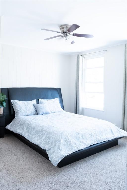 bedroom with carpet and ceiling fan