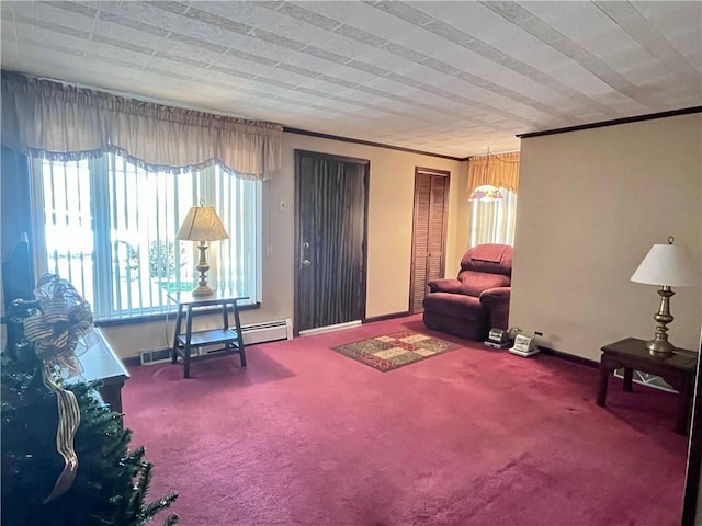 sitting room with carpet flooring, a baseboard radiator, a wealth of natural light, and crown molding