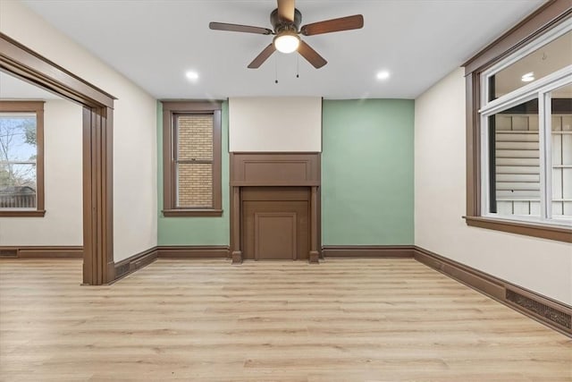 unfurnished room featuring ceiling fan and light hardwood / wood-style floors