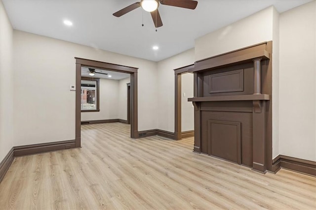 spare room featuring ceiling fan and light hardwood / wood-style floors