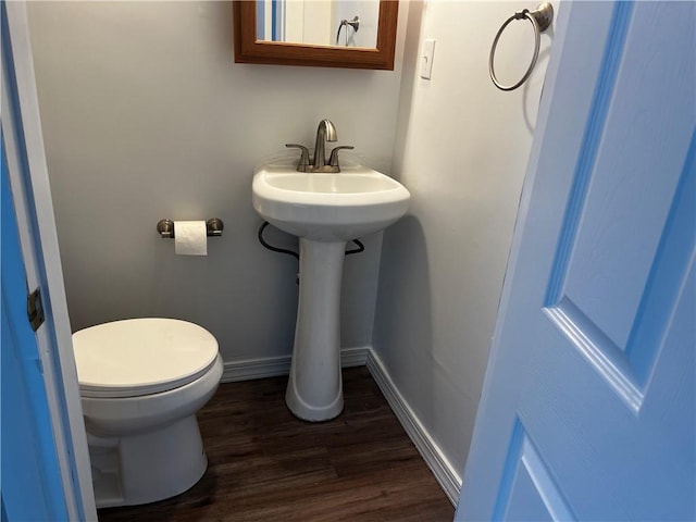 bathroom featuring toilet and hardwood / wood-style flooring