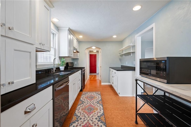 kitchen with white cabinetry, sink, and appliances with stainless steel finishes