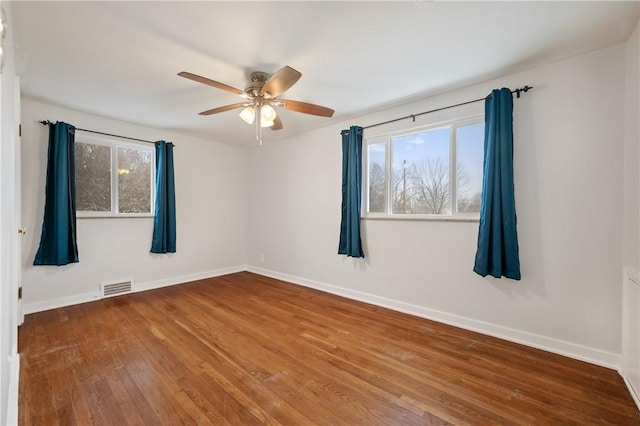 spare room featuring ceiling fan and wood-type flooring