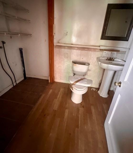 bathroom with sink, wood-type flooring, and toilet