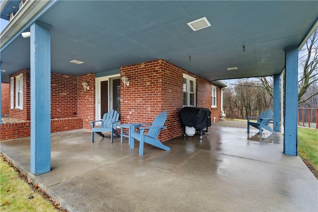 view of patio with a grill