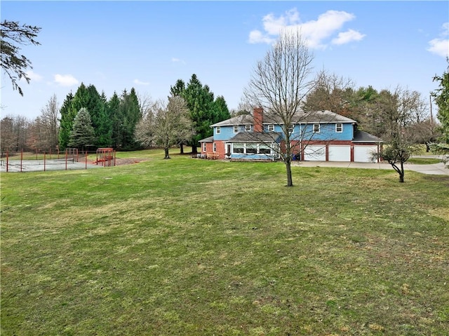 view of yard with a garage