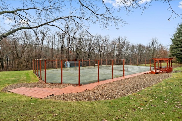 view of home's community featuring a yard, basketball court, and tennis court