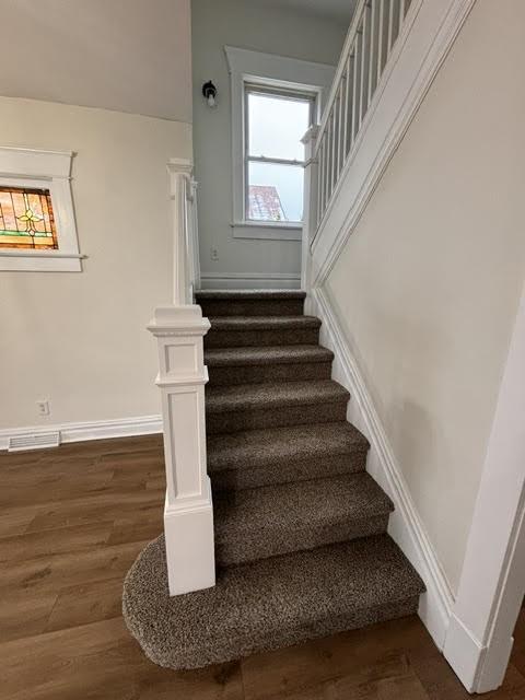 staircase featuring hardwood / wood-style floors