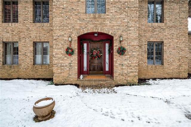 view of snow covered property entrance