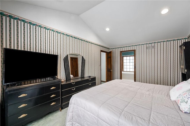 carpeted bedroom featuring lofted ceiling