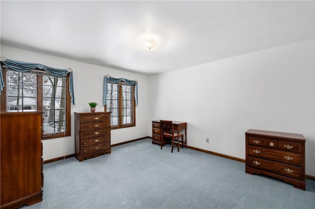 living area featuring light carpet and a wealth of natural light