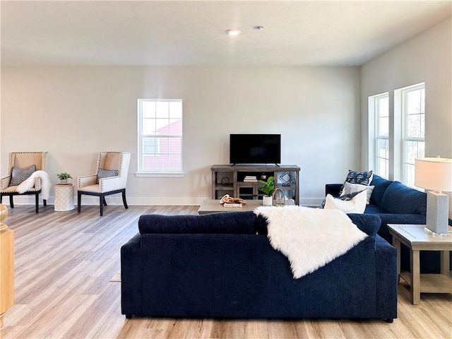 living room with light hardwood / wood-style flooring