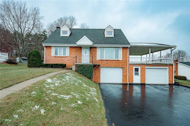 view of front of home featuring a garage and a front lawn