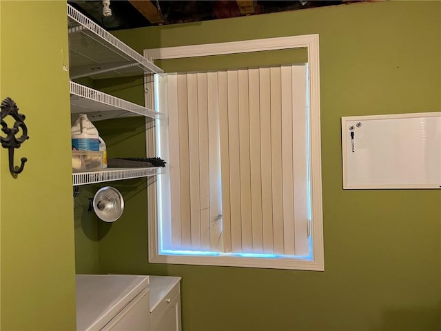 laundry room with washing machine and clothes dryer