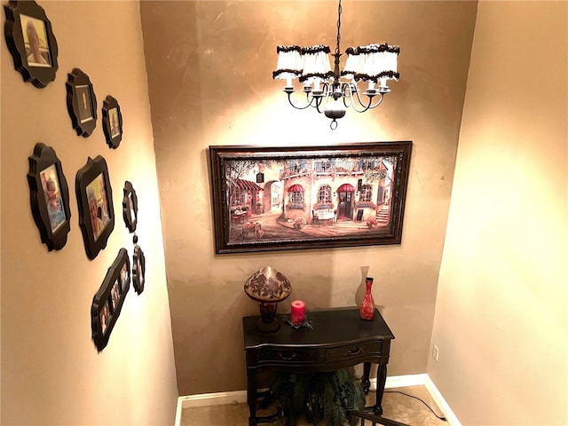 hallway with a chandelier