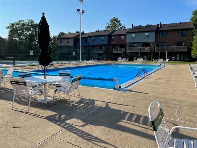 view of swimming pool featuring a patio area