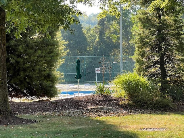 view of sport court with basketball hoop