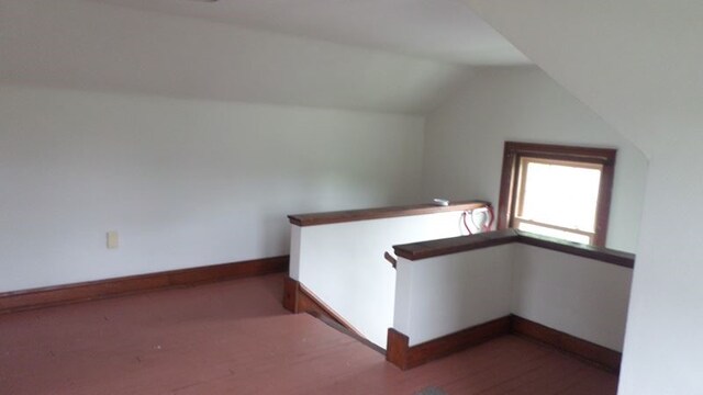 interior space with hardwood / wood-style floors and lofted ceiling