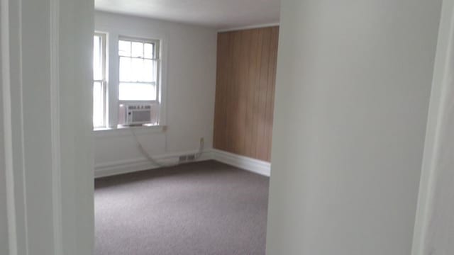 carpeted empty room featuring cooling unit