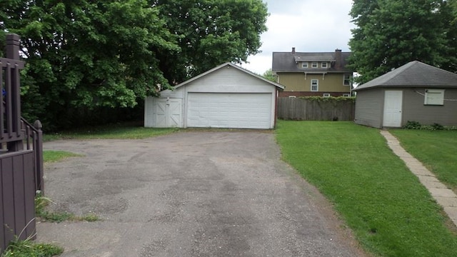 garage featuring a lawn