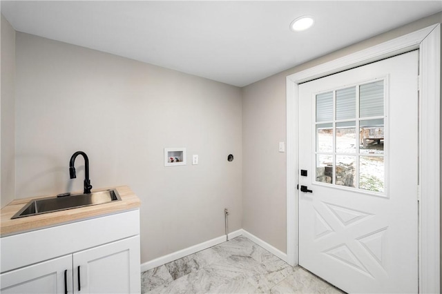 clothes washing area with cabinets, sink, and hookup for a washing machine