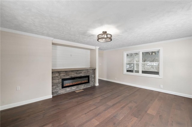 unfurnished living room featuring a fireplace, a textured ceiling, dark hardwood / wood-style floors, and ornamental molding