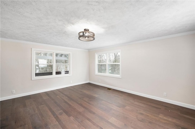 unfurnished room with dark hardwood / wood-style flooring, a textured ceiling, and ornamental molding