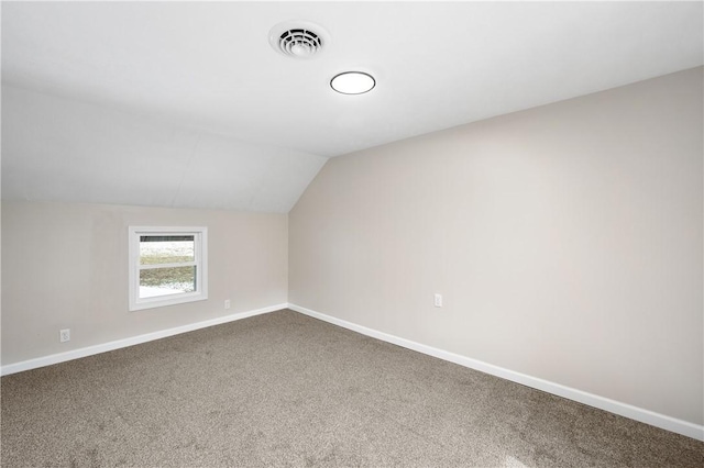 bonus room featuring carpet and vaulted ceiling