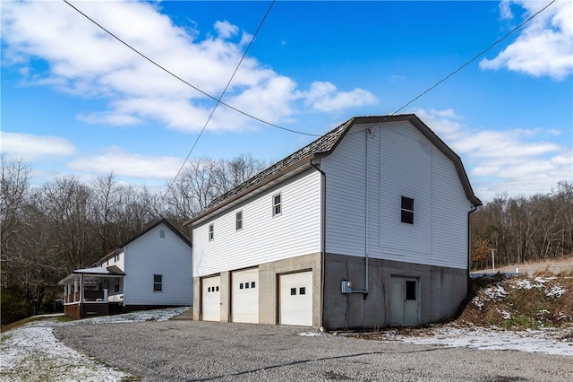 view of side of property with a garage