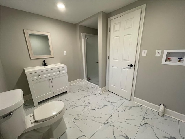 bathroom featuring vanity, an enclosed shower, and toilet