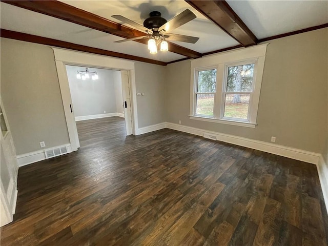 empty room featuring beam ceiling, dark hardwood / wood-style flooring, and ceiling fan