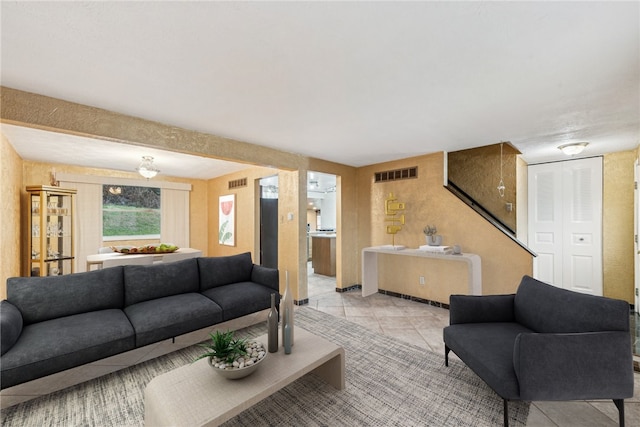 living room with light tile patterned flooring