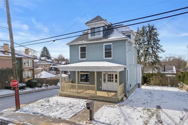 front facade featuring covered porch