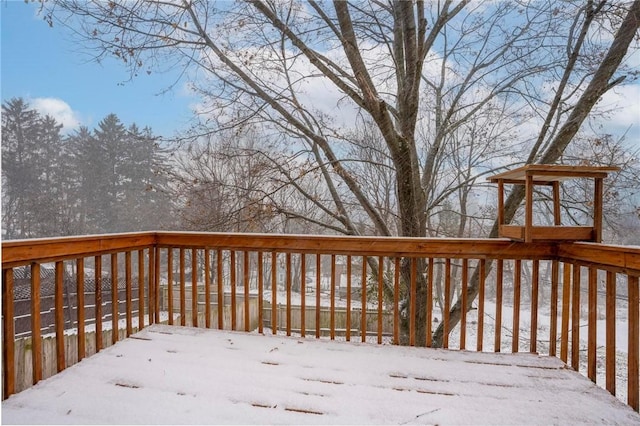 view of snow covered deck