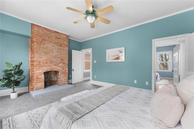 carpeted bedroom featuring a fireplace, ceiling fan, and crown molding