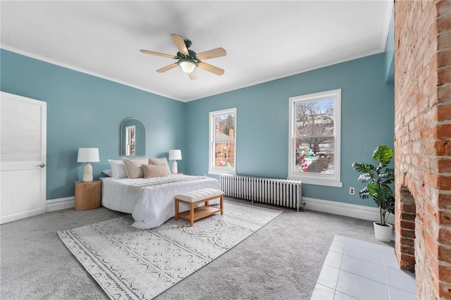 carpeted bedroom featuring radiator and ceiling fan