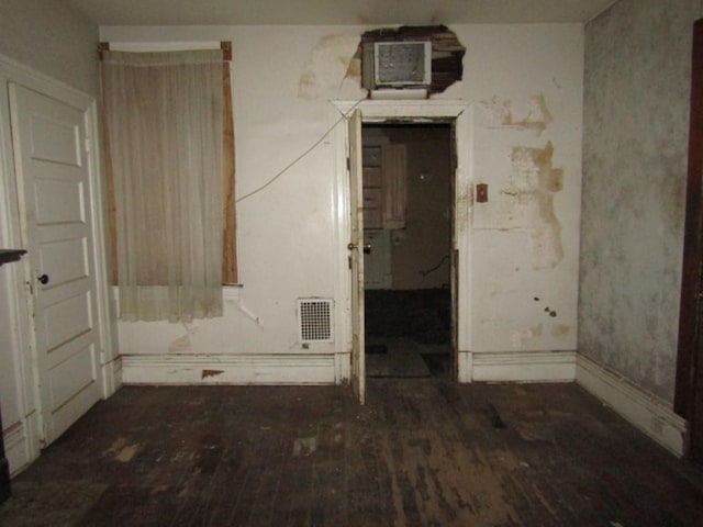 spare room with dark wood-type flooring