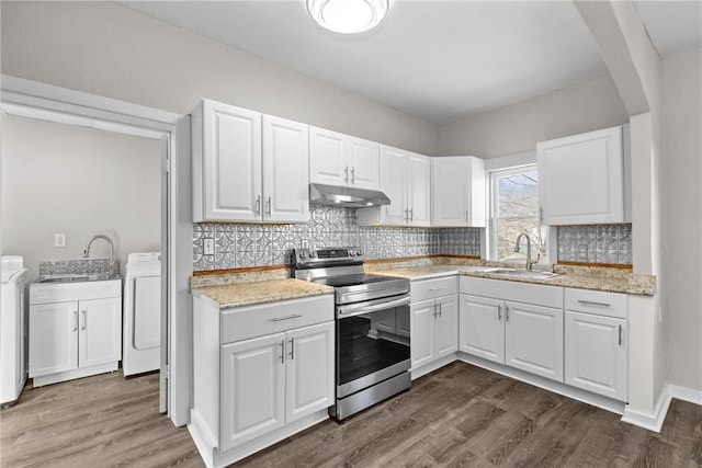 kitchen featuring white cabinets, washer / clothes dryer, stainless steel range with electric stovetop, and sink