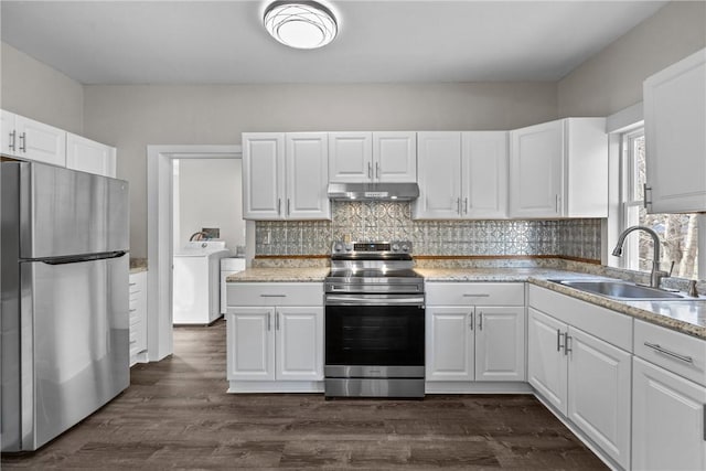 kitchen with appliances with stainless steel finishes, sink, washer / clothes dryer, white cabinetry, and dark hardwood / wood-style floors