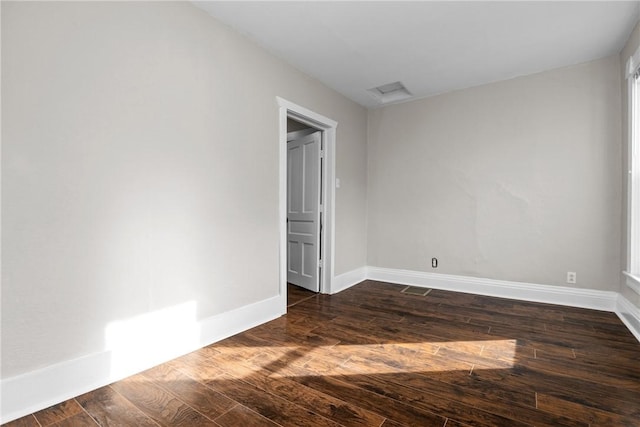 empty room with dark hardwood / wood-style floors