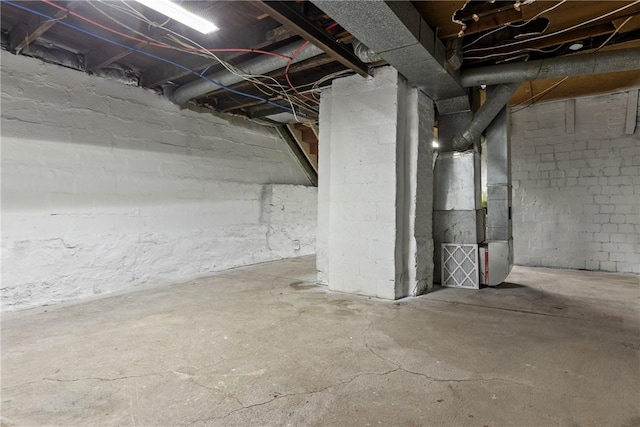 basement featuring heating unit